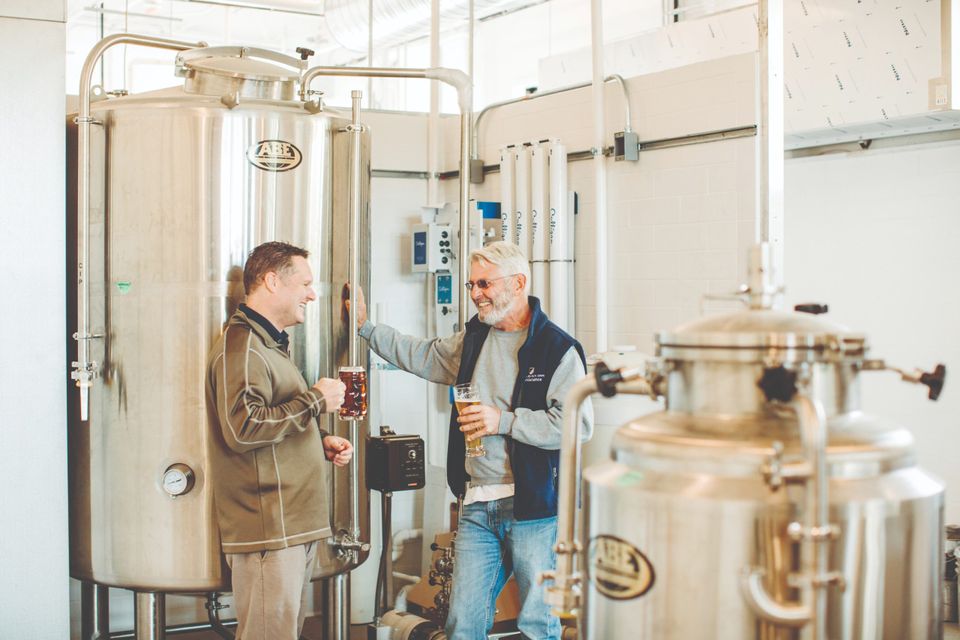 Two people in a brewery
