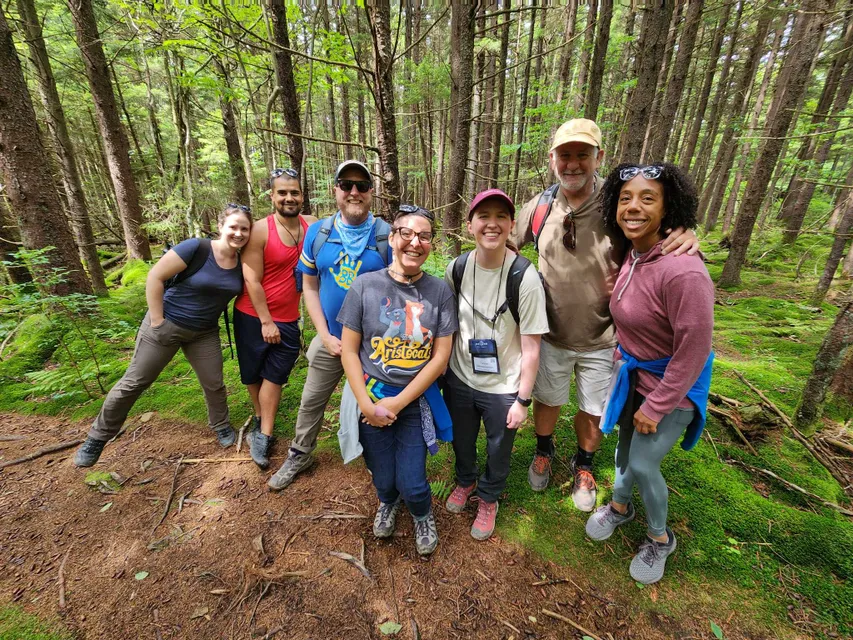 Group photo of hiking participants on a trail